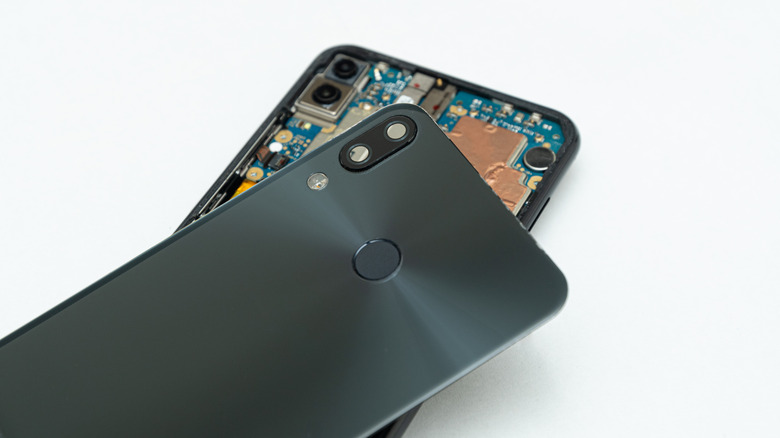 Showing a phone that has been opened to reveal the motherboard