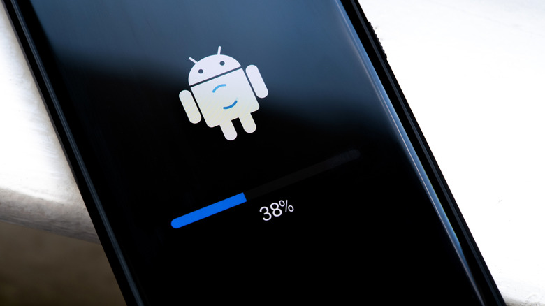 Android logo showing the percent of an update install on a black screen