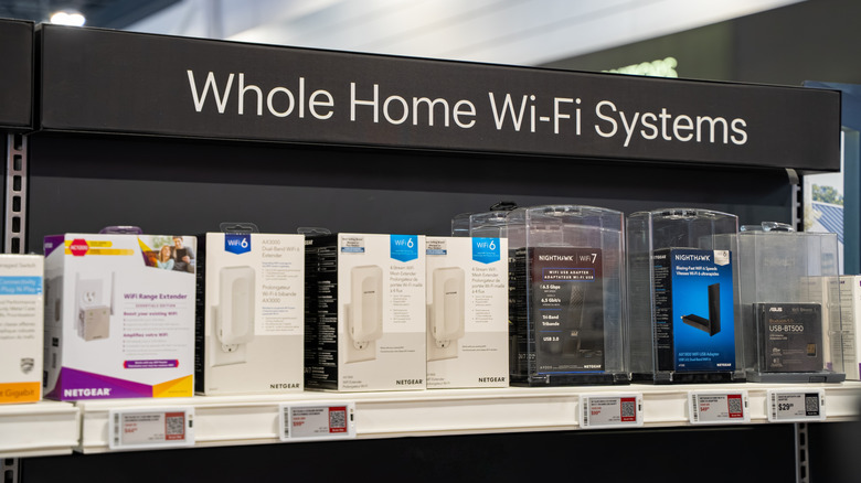 An assortment of Wi-Fi mesh systems on a retail shelf