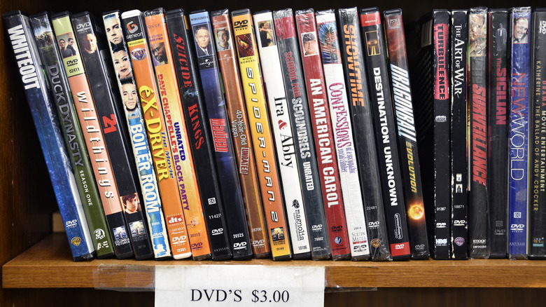 DVD movies on a shelf for sale