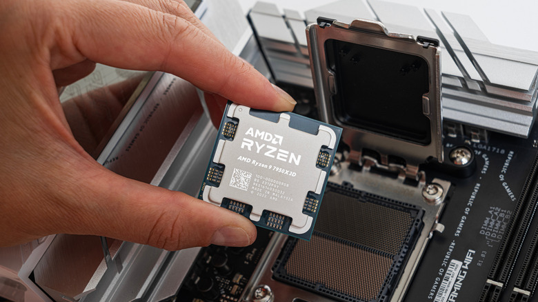 AMD Ryzen processor being installed into a motherboard CPU socket