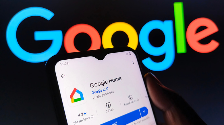Google logo in background, with phone featuring Google Home in foreground