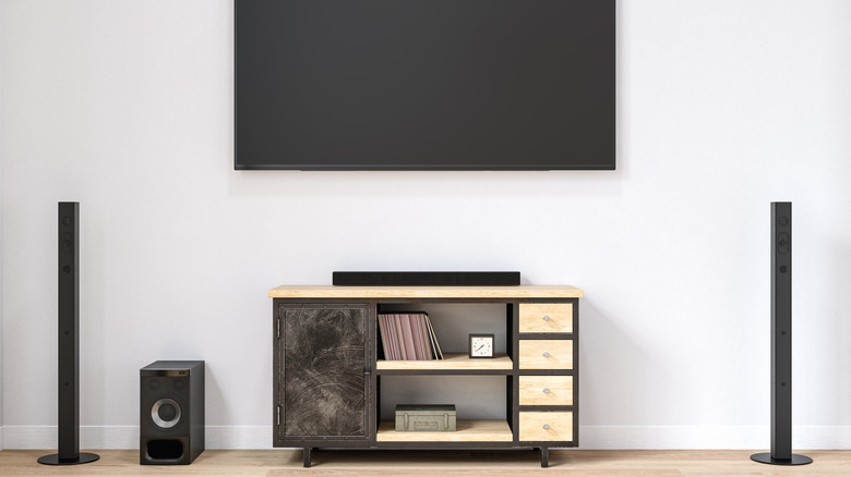A modern living room with a soundbar-based audio system.