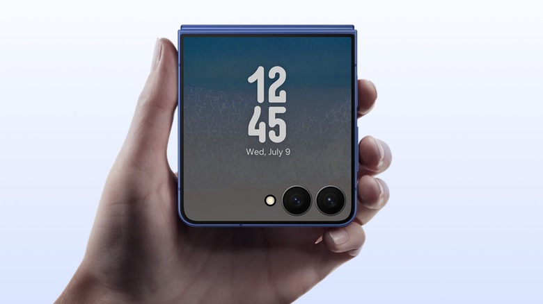 A closeup of a Samsung Galaxy 7 Flip as it held in an individual's left hand