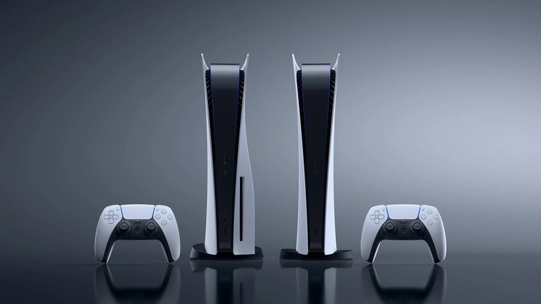 Two PS5 consoles, one with a disc drive and one without, with DualSense controllers on either side