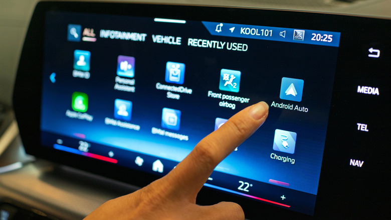 Android Auto shown on an in-car infotainment system alongside other applications
