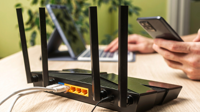 A router with multiple LAN ports on a desk