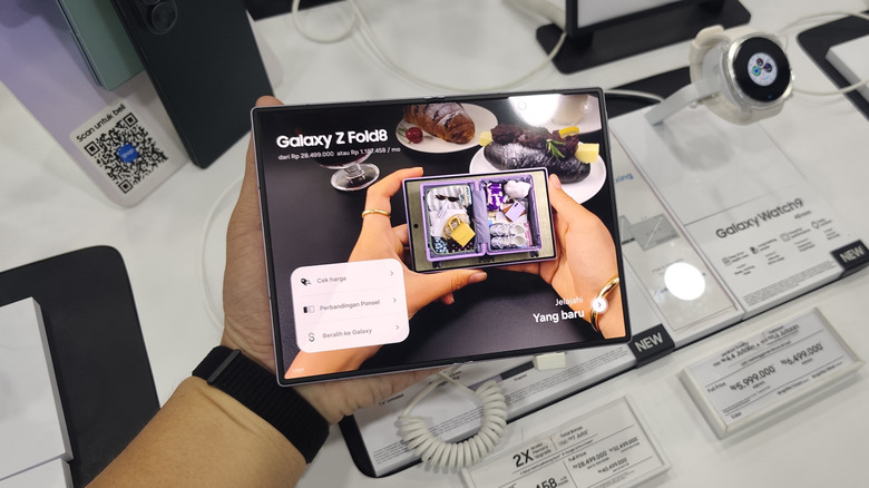 Samsung Galaxy Z Fold8 held open in a store display