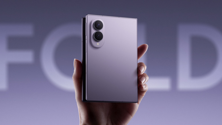 Samsung Galaxy Z Fold8 held in hand with a blurred Fold background