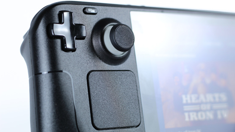a close up of the Steam deck's joystick, directional pad, view button, and left trackpad