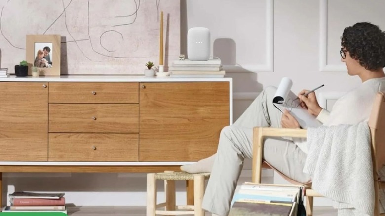 A Google Nest Audio speaker in an artsy living room