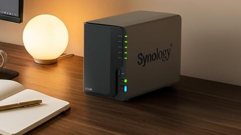 The Synology DS225+ set up on a computer desk.