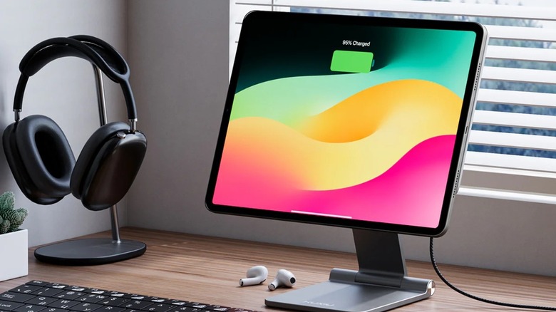 An iPad mounted to a magnetic charging stand