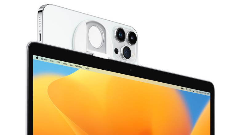 iPhone attached horizontally to the top of MacBook laptop via Belkin mount