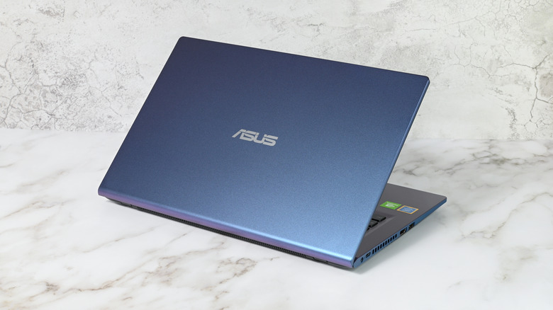 An ASUS laptop on a granite counter.