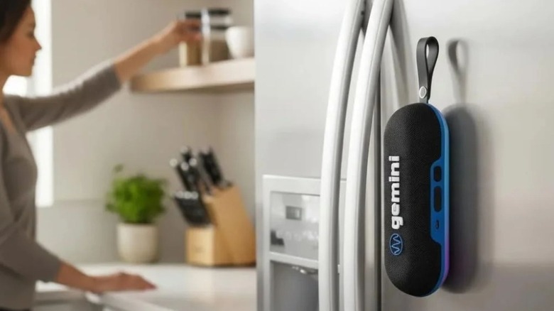 TheGemini BeatGrip Magnetic Bluetooth Speaker attached to a refrigerator door