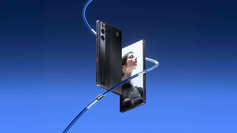The RedMagic 11 Pro smartphone against a blue background surrounded by a liquid cooling loop