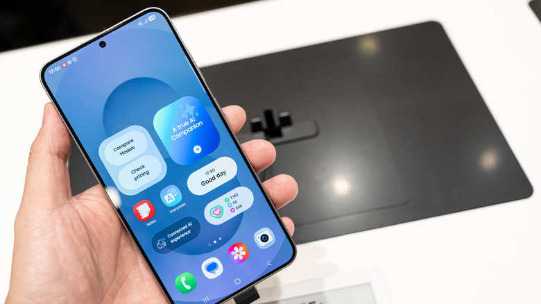 A person holding the Samsung Galaxy S25 Plus smartphone in their hand