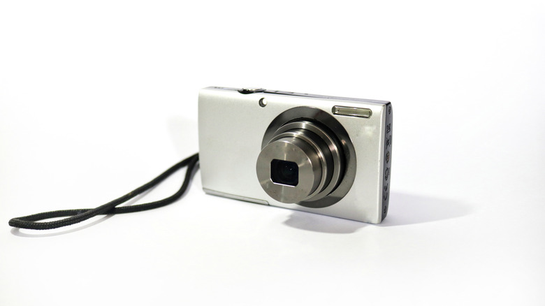 Digital camera on white background