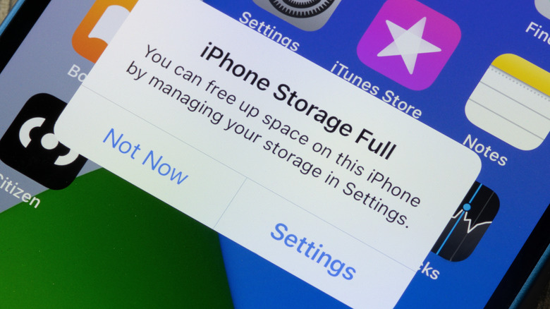 An iPhone displaying the iPhone Storage Full prompt within iOS