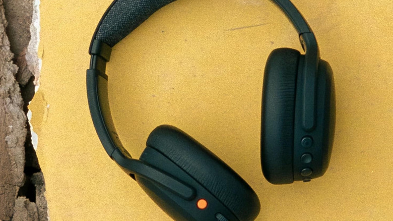 The Skullcandy Crusher ANC 2 Headphones set against a yellow-walled backdrop.