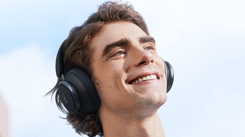 A man wearing the Soundcore Space Q45 Headphones in an outdoor setting.