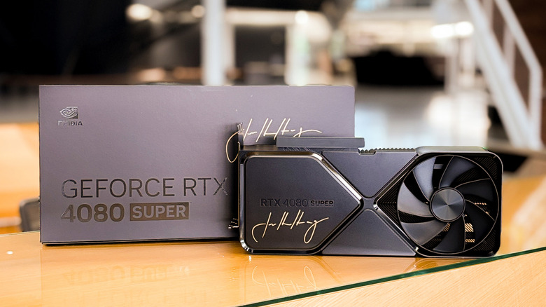 Nvidia GeForce RTX 4080 SUPER Edition signed by CEO Jensen Huang, displayed beside its box