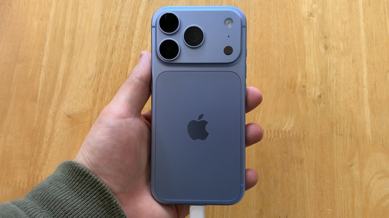 Close-up of iPhone 18 plugged into a USB charger