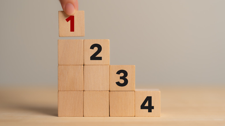 Hand ranking different wooden boxes