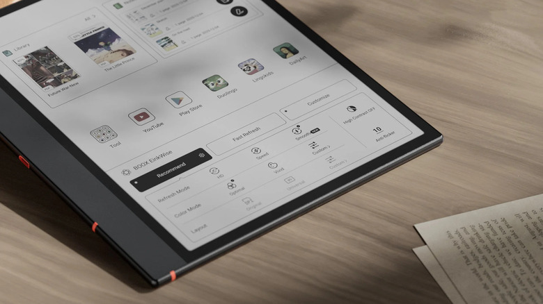 Boox Note Air5 C laying on table next to papers