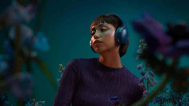 Person wearing Bose QuietComfort headphones