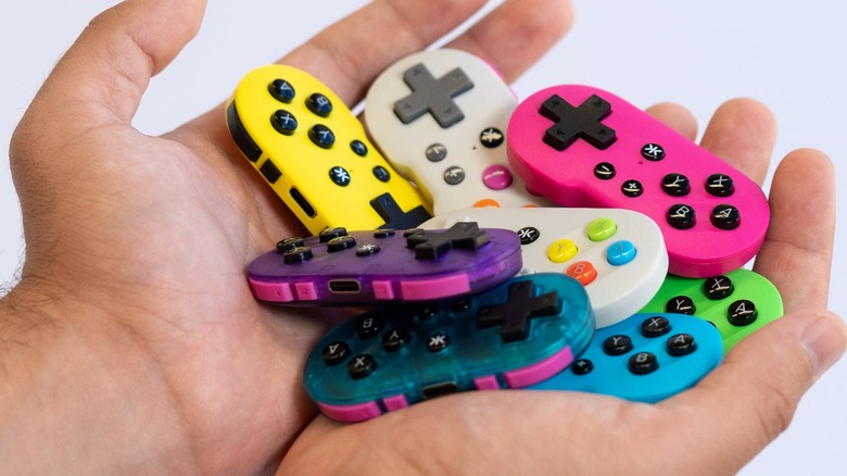 Man holding CRKD ATOM controllers