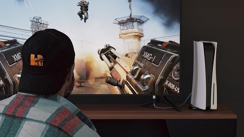 A person playing a game on their TV using a PS5