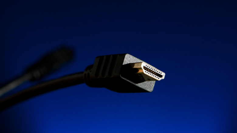 An HDMI cable against a dark blue background