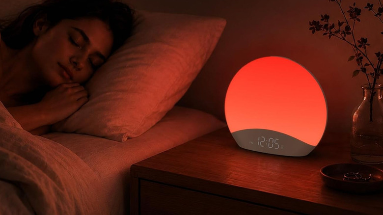 Sleeping with the Reacher Smart Sunrise Alarm Clock on a bedside table