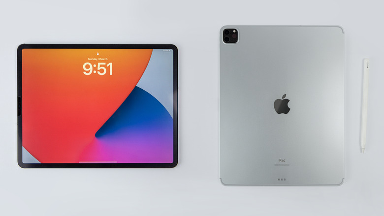 Apple iPad Pro M5 shown from the front and back alongside an Apple Pencil.