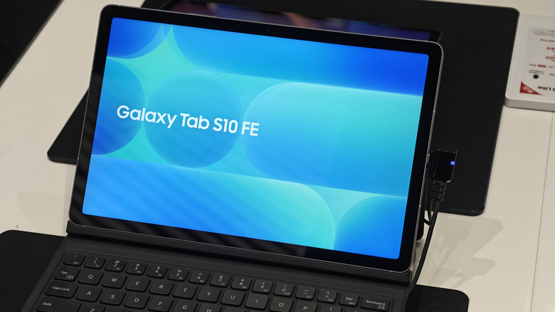 Samsung Galaxy Tab S10 FE displayed on a keyboard case with its screen turned on