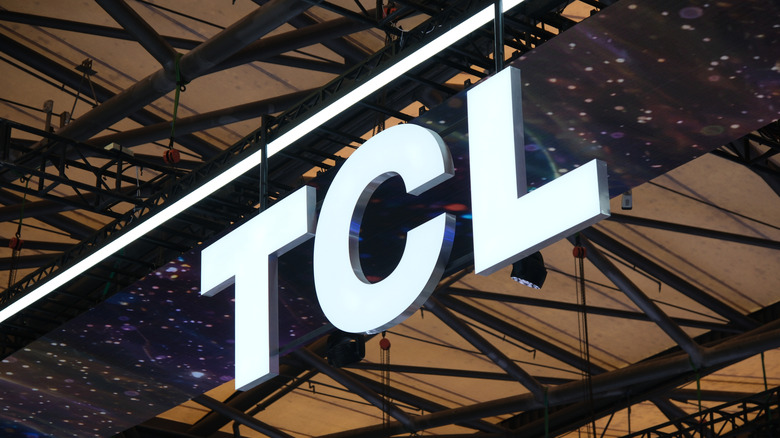 White TCL logo hanging from the ceiling.