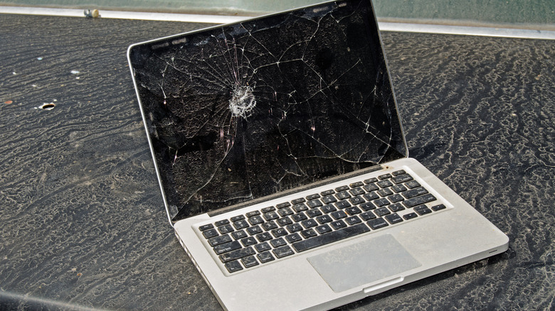 A laptop with its display glass shattered