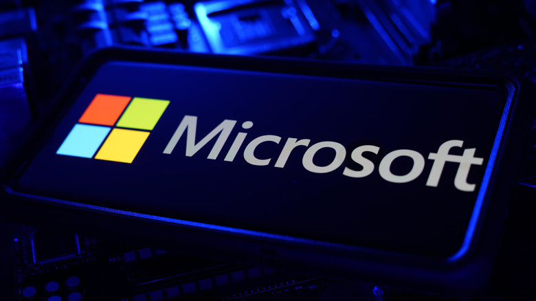 Microsoft logo on phone in dark