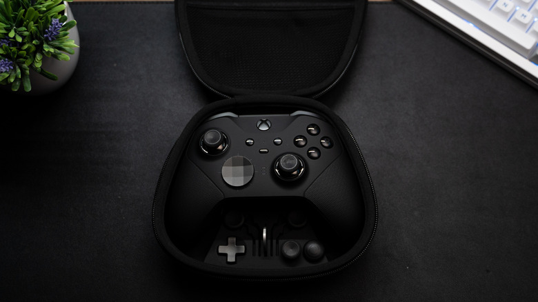 xbox elite controller in packaging with add-ons visible in carry case