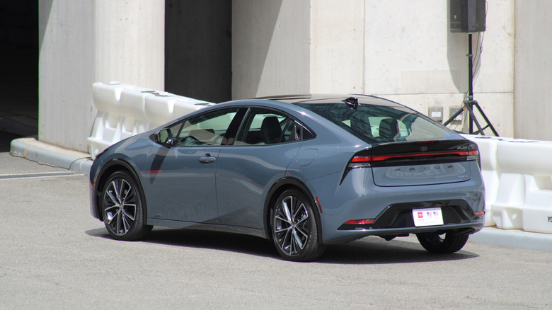 Toyota Prius Prime parked on side of lot.
