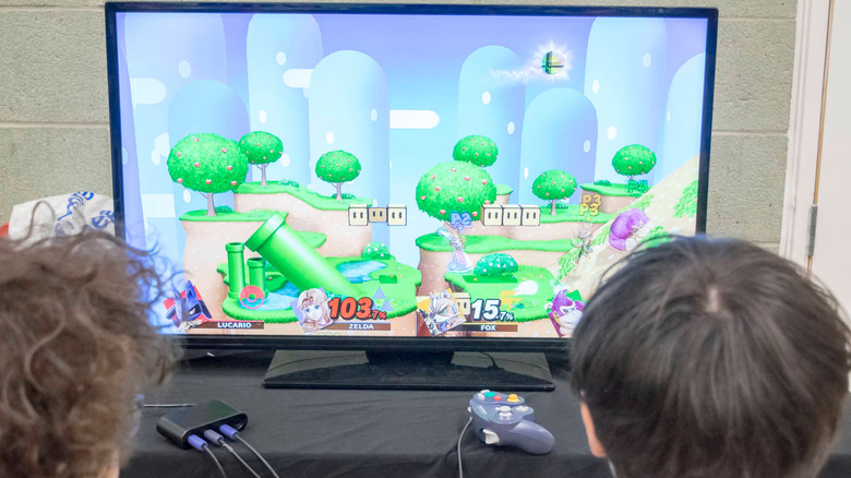 Two kids playing Super Smash Bros. Melee on a TV