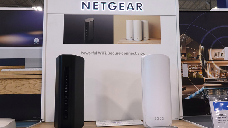 Two Netgear mesh Wi-Fi units on display at a shopping center