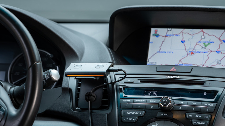 A driver receives directions from an Amazon Echo Auto.