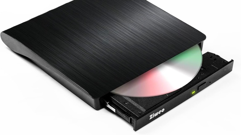 A portable CD-ROM drive partially open on white background