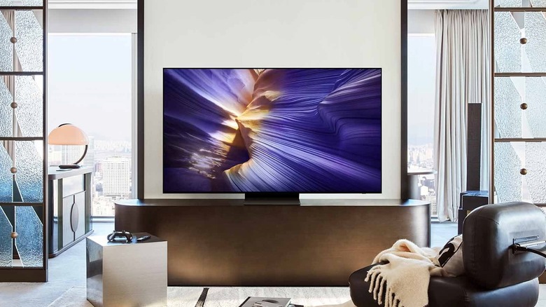 Samsung S90F OLED TV placed on media center in a living room