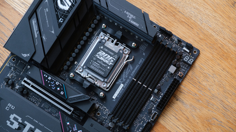 An Asus motherboard sitting on a table