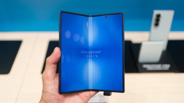Someone holding a Galaxy Z Fold 7 in the Samsung Store