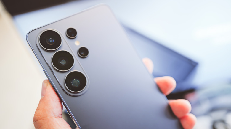 an up close shot of a person holding the Samsung Galaxy S26 Ultra